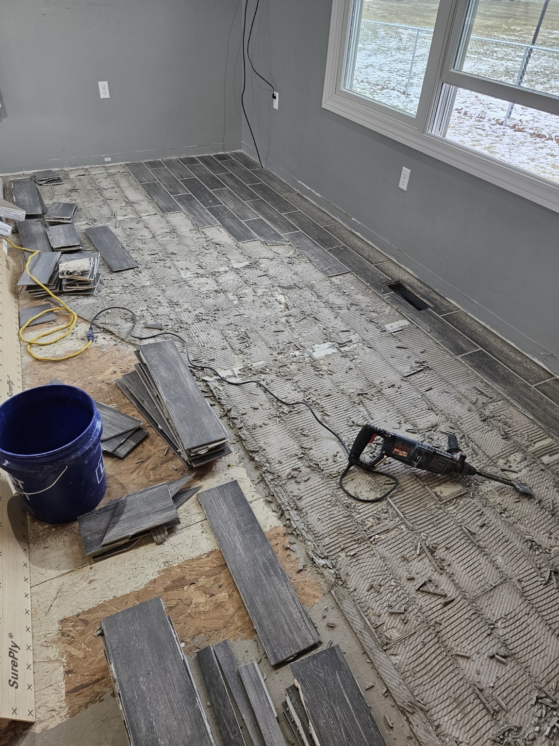 Existing flooring removal and subfloor preparation