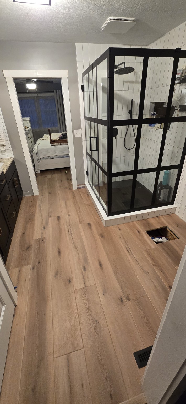 Finished wood look flooring in bathroom